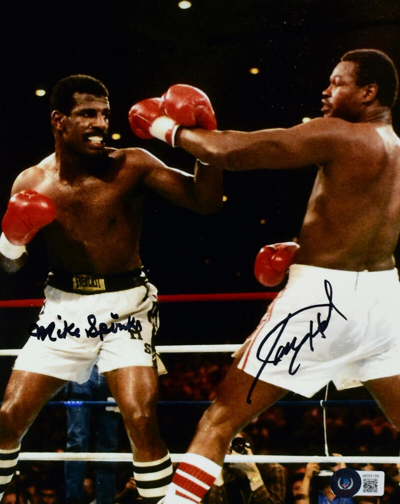 Michael Spinks Larry Holmes Autographed 8x10 Fight Photo - Beckett W Hologram: Michael Spinks Larry Holmes Autographed 8x10 Fight Photo - Beckett W Hologram Sport: Boxing Product: Photo Original/Reprint: Original Player: Michael Spinks Larry Holmes Autograph Authentication: Beck