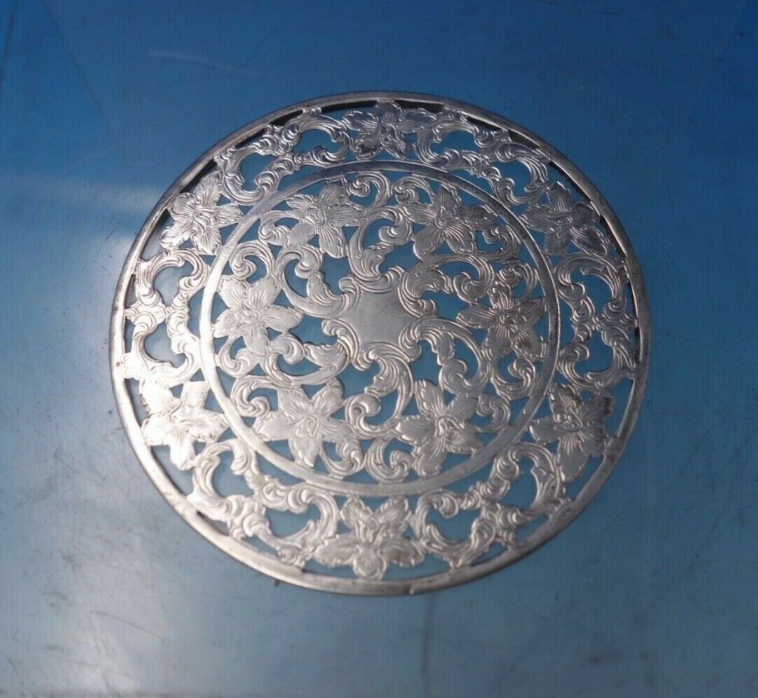 Glass Trivet Plate for Drinking Glass with Sterling Silver Overlay 3": Glass Trivet Plate for Drinking Glass with Sterling Silver Overlay 3" Superb glass, trivet for drinking glass, with sterling silver overlay (unmarked, maker unknown). This piece measures 3" in diamete
