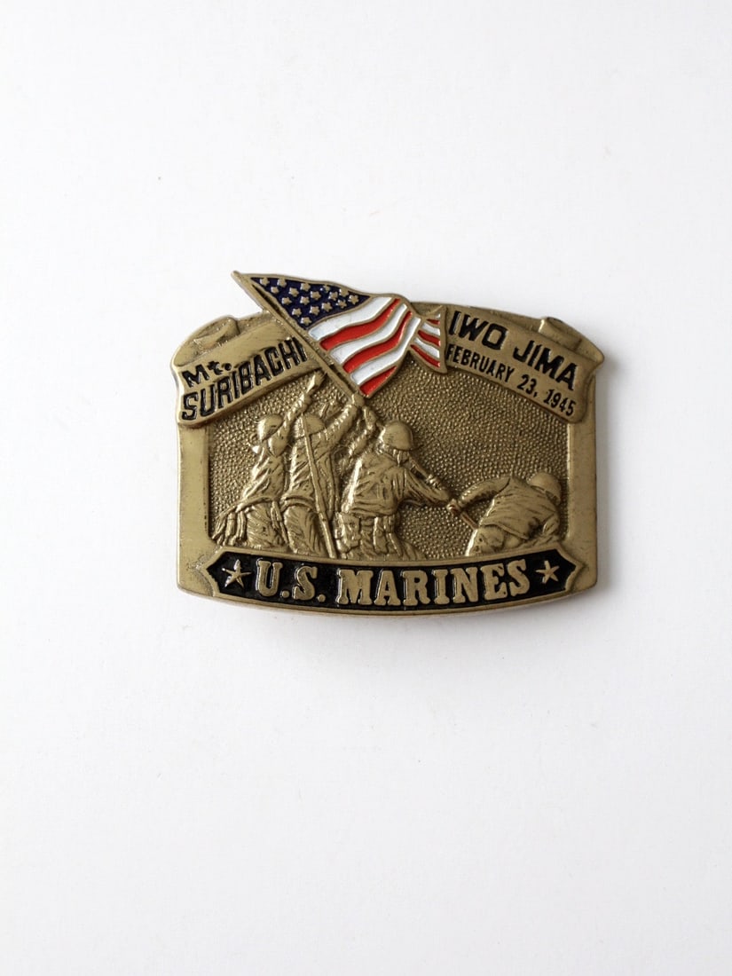 Vintage Us Marines Brass Buckle: Vintage Us Marines Brass Buckle A 1980s solid brass belt buckle. It honors the US Marines flag raising atop Mt. Suribachi in Iwo Jima on February 23 1945. Red white and blue enamel accents the flag. I