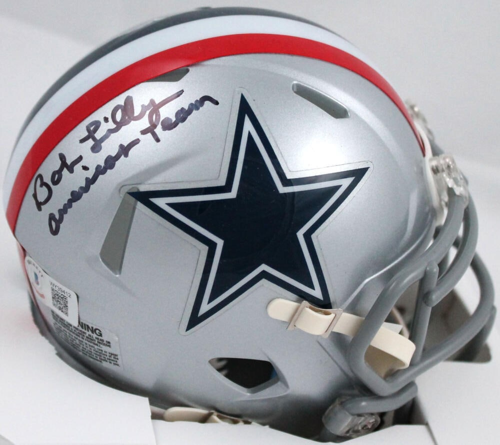 Bob Lilly Signed Cowboys 76 Speed Mini Helmet w/Americas Team-Beckett W Hologram: Bob Lilly Signed Cowboys 76 Speed Mini Helmet w/Americas Team-Beckett W Hologram Sport: Football-NFL Product: Helmet Original/Reprint: Original Player: Bob Lilly Team: Dallas Cowboys Autograph Authent