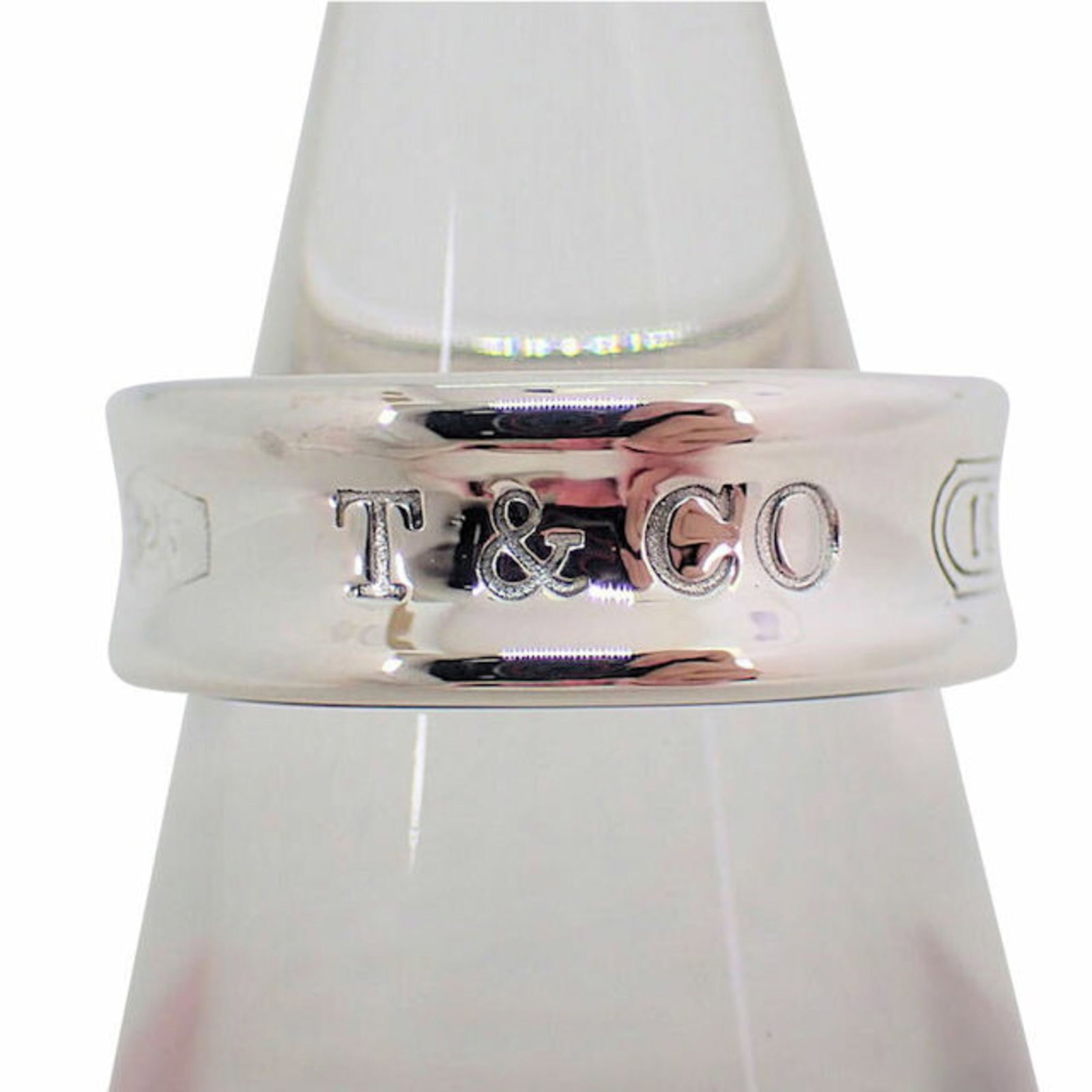TIFFANY Tiffany 925 1837 ring No. 10: TIFFANY Tiffany 925 1837 ring No. 10 Brand: Tiffany Type: Band ring Gender: Women Material: Sterling silver 925 US Size: 5.5 Width: 6.6mm / 0.26 Weight: 6.5g / 0.22oz. Condition: Used (very good) Over