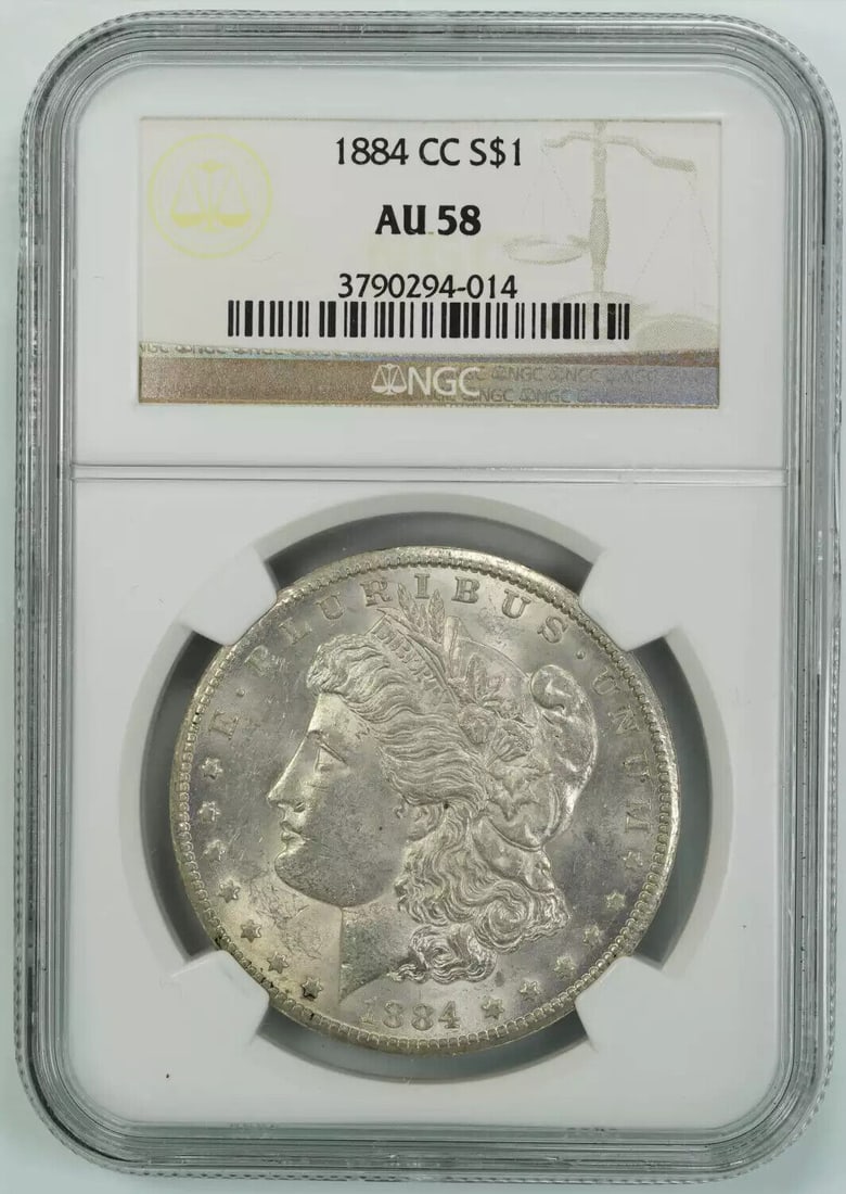1884 CC MORGAN SILVER DOLLAR S$1 NGC CERTIFIED AU 58 ABOUT UNCIRCULATED (014): 1884 CC MORGAN SILVER DOLLAR S$1 NGC CERTIFIED AU 58 ABOUT UNCIRCULATED (014) Certification: NGC Composition: Silver Grade: AU 58 Year: 1884 Circulated/Uncirculated: Circulated Mint Location: CARSON C