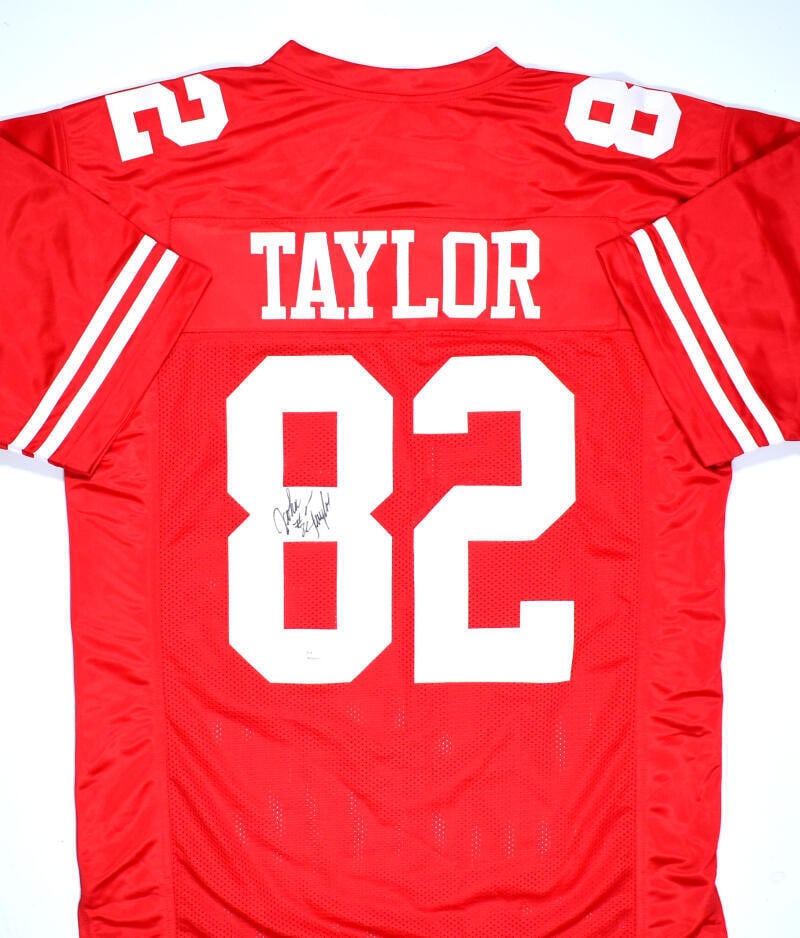 John Taylor Autographed Red Pro Style Jersey - JSA W *Black: John Taylor Autographed Red Pro Style Jersey - JSA W *Black Sport: Football Product: Jersey Original/Reprint: Original Player: John Taylor Team: San Francisco 49ers Autograph Authentication: James Spe
