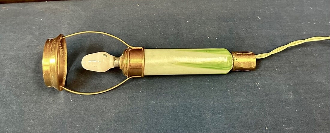 Tiffany Studios Candle Lamp Part: Tiffany Studios Candle Lamp Part Type: lamp part Color: Green White Gold Number In Pack: 1 Material: Brass Glass Vintage: Yes This vintage original Tiffany Studios candlestick lamp part dates from the