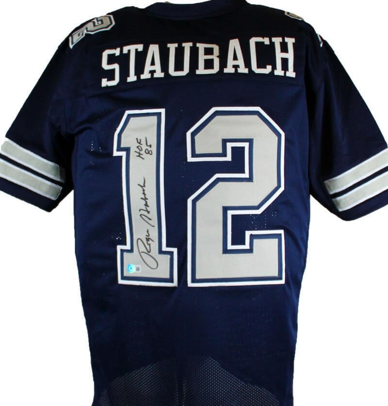 Roger Staubach Autographed Blue/Grey Pro Style Jersey w/HOF- Beckett W Hologram: Roger Staubach Autographed Blue/Grey Pro Style Jersey w/HOF- Beckett W Hologram Sport: Football-NFL Product: Jersey Original/Reprint: Original Player: Roger Staubach Team: Dallas Cowboys Autograph Aut