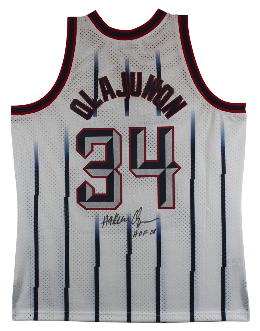 Rockets Hakeem Olajuwon "HOF 08" Signed White Mitchell & Ness Jersey BAS Witness: Rockets Hakeem Olajuwon "HOF 08" Signed White Mitchell & Ness Jersey BAS Witness Sport: Basketball Product: Jersey Original/Reprint: Original Player: Hakeem Olajuwon Autograph Authentication: Beckett 