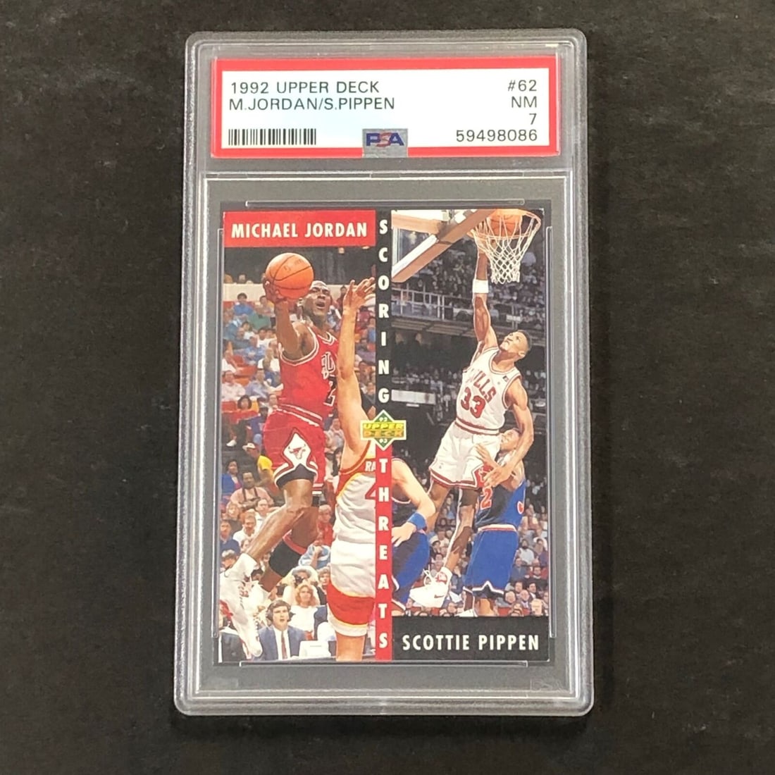 1992 Upper Deck #62 Michael Jordan/Scottie Pippen PSA 7 NM Scoring Threats: 1992 Upper Deck #62 Michael Jordan/Scottie Pippen PSA 7 NM Scoring Threats Sport: basketball Graded: Yes Pre-Owned While the lot images are representative of the item, the size, placement and strength
