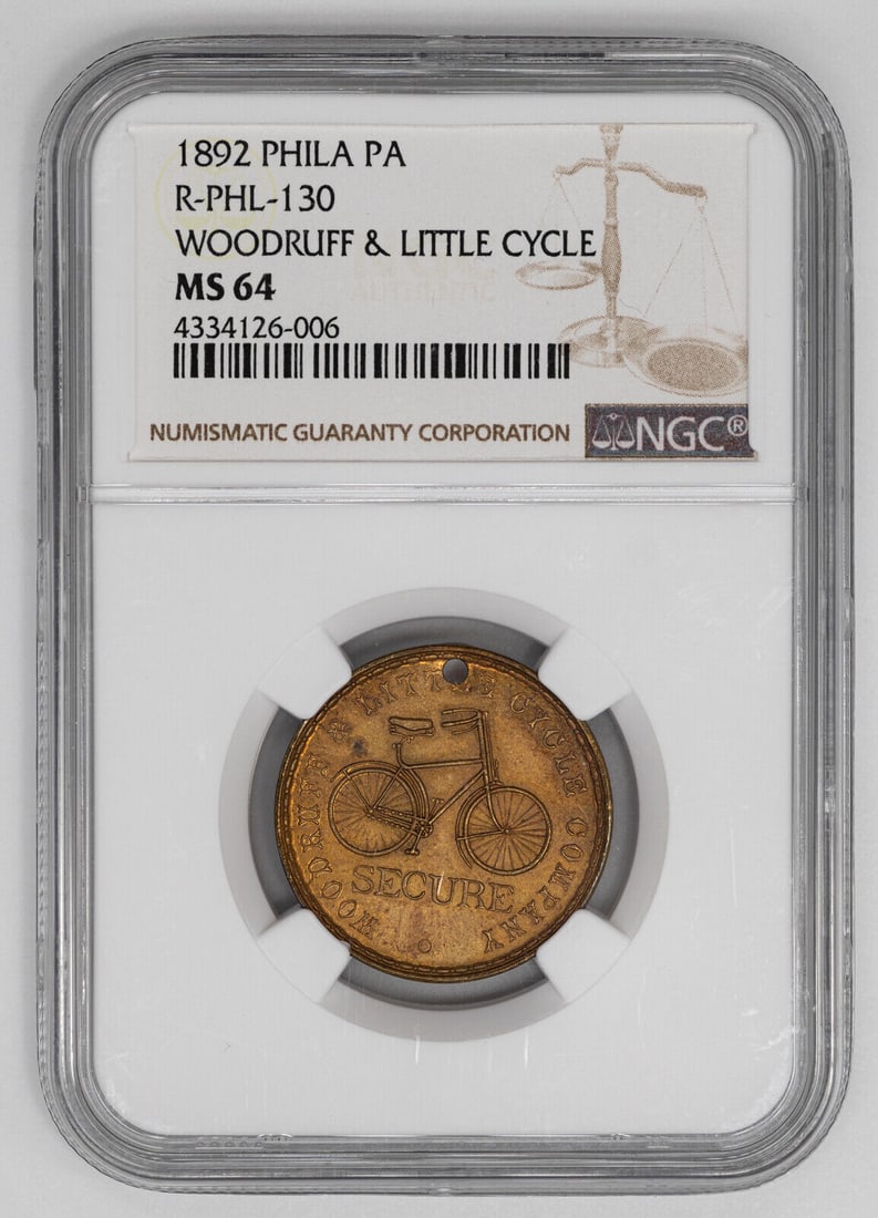 1892 WOODRUFF & LITTLE CYCLE TOKEN PHILADELPHIA NGC MS 64 MINT STATE UNC (006): 1892 WOODRUFF & LITTLE CYCLE TOKEN PHILADELPHIA NGC MS 64 MINT STATE UNC (006)Certification Number: 4334126-006Certification: NGCGrade: MS 64Year: 1892Circulated/Uncirculated: UncirculatedPre-Owned Wh
