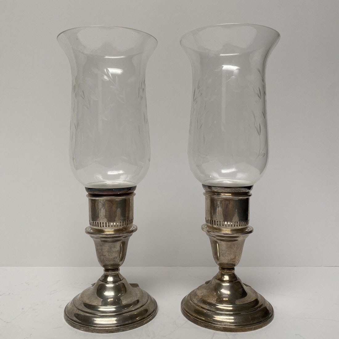 Set of 2 Sterling Silver & Glass Candle Lanterns: Set of 2 Sterling Silver & Glass Candle Lanterns Composition: Sterling Silver Brand: Unknown Type: Candlestick Pre-Owned The MYNT Guarantee: All items in this auction are guaranteed to be 100% authent