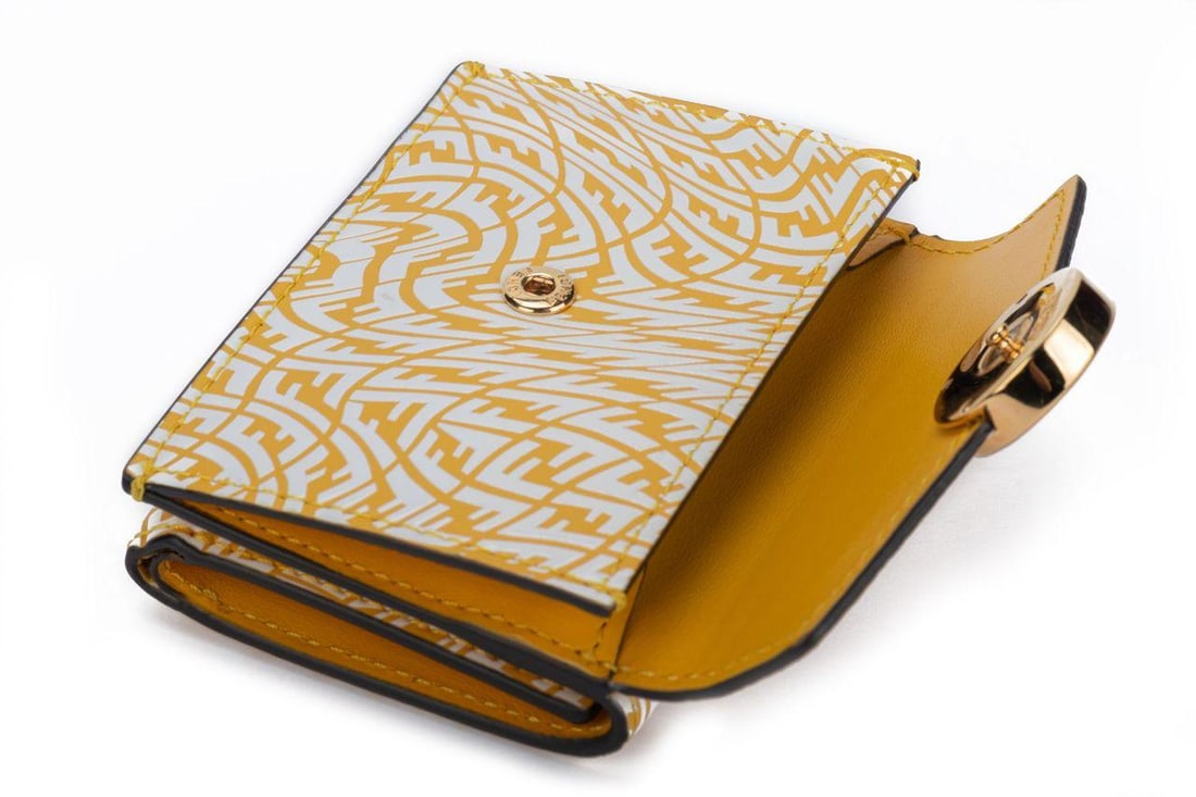 Fendi x Sarah Coleman Wallet NIB: Fendi x Sarah Coleman Wallet NIB Designer: Fendi Dimensions: Height: 2.75 in (6.99 cm)Width: 1.25 in (3.18 cm)Length: 3.75 in (9.53 cm) Place of Origin: Italy Period: 21st Century Pre-Owned The Mynt G