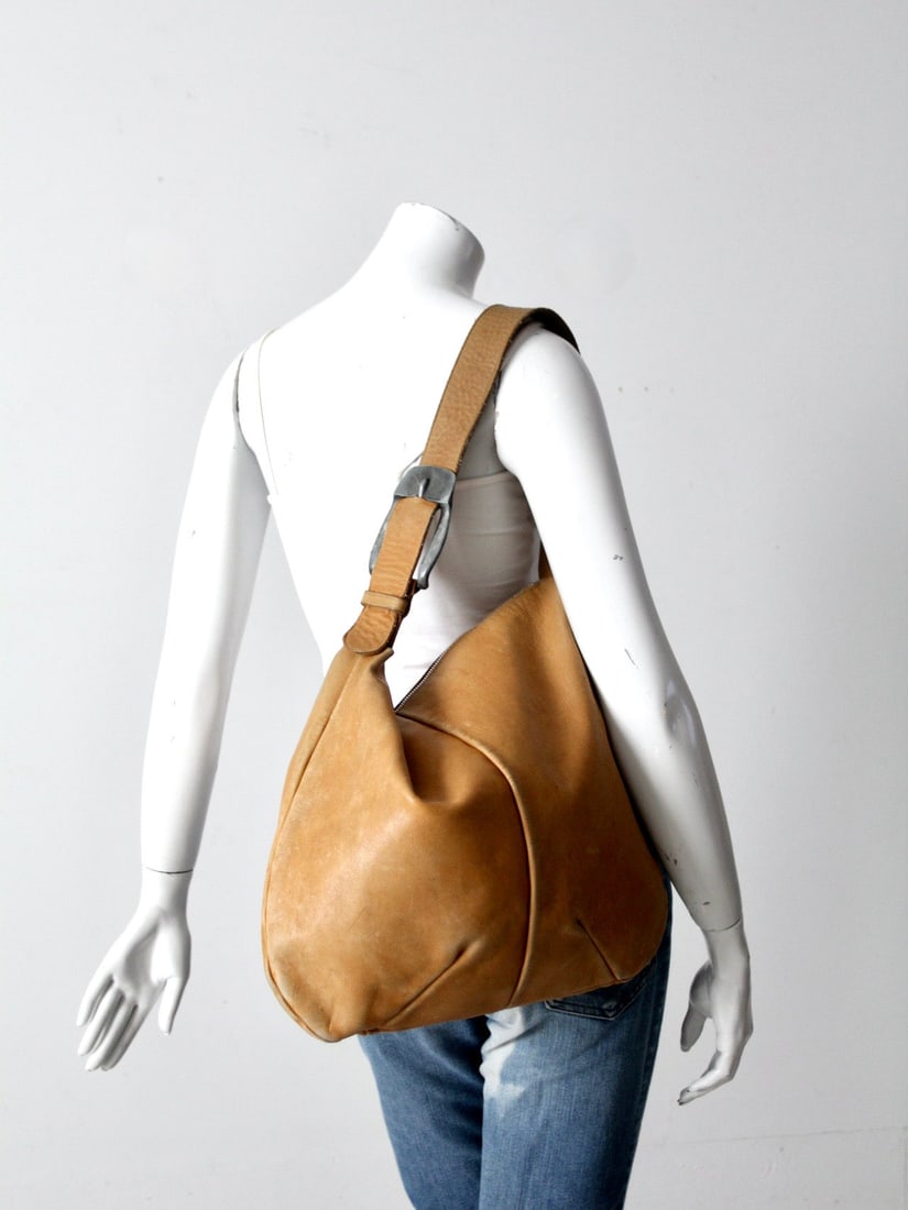 On Hold // Reserve Vintage 70S Leather Shoulder Bag: On Hold // Reserve Vintage 70S Leather Shoulder Bag This is a vintage 70s leather bag. The soft tan leather bag has a great oversize shape with a large pewter buckle accenting the shoulder strap. Big 