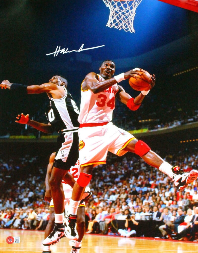 Hakeem Olajuwon Signed Rockets 16x20 Rebound Against Robinson Photo- Beckett*Wte: Hakeem Olajuwon Signed Rockets 16x20 Rebound Against Robinson Photo- Beckett*Wte Sport: Basketball Original/Reprint: Original Autograph Authentication: James Spence (JSA) Pre-Owned While the lot image