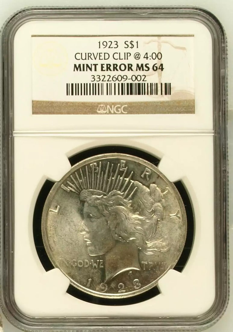 Peace Silver Dollar 1923 NGC MS-64Mint Error CURVED CLIP @ 4:00: Peace Silver Dollar 1923 NGC MS-64Mint Error CURVED CLIP @ 4:00 Certification: NGC Composition: Silver Grade: MS 64 Year: 1923 Circulated/Uncirculated: Uncirculated Mint Location: Philadelphia Country
