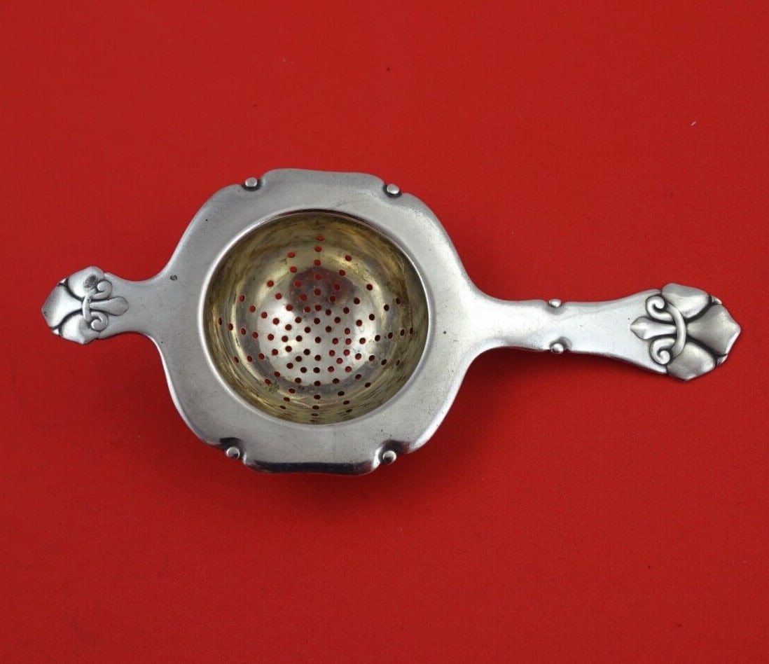 French Lily by Orla Vagn Mogensen Sterling Silver Tea Strainer Original 5 1/2": French Lily by Orla Vagn Mogensen Sterling Silver Tea Strainer Original 5 1/2" Pattern: French Lily Composition: Sterling Silver Type: Tea Strainer Maker: Orla Vagn Mogensen Age: 1900-1940 French lily