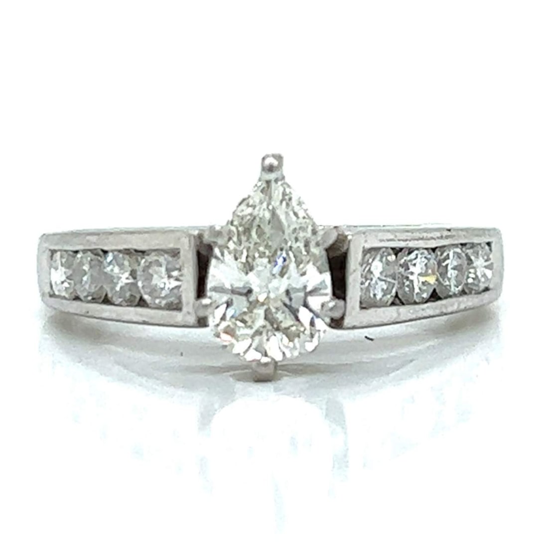 Platinum Diamond Engagement Ring: Platinum Diamond Engagement Ring Platinum Diamond Engagement Ring Weighing 6.1 grams Set with an app. 0.75 Ct. Pear-shaped Diamond in Center I-J Color, VVS Clarity Along with 8 Diamonds set in mountin