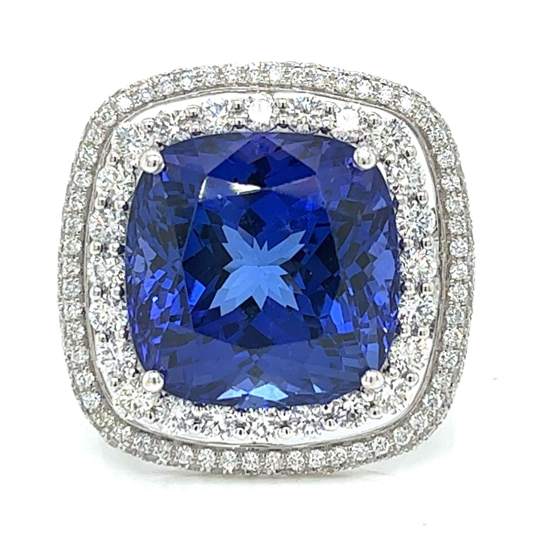 18K White Gold 30.00 Ct. Tanzanite & Diamond Ring: 18K White Gold 30.00 Ct. Tanzanite & Diamond Ring 18K White Gold 30.00 Ct. Tanzanite & Diamond Ring Weighing 17.3 grams Set with an app. 30.00 Ct. Tanzanite Along with 2.45 Ct. of Diamonds (St