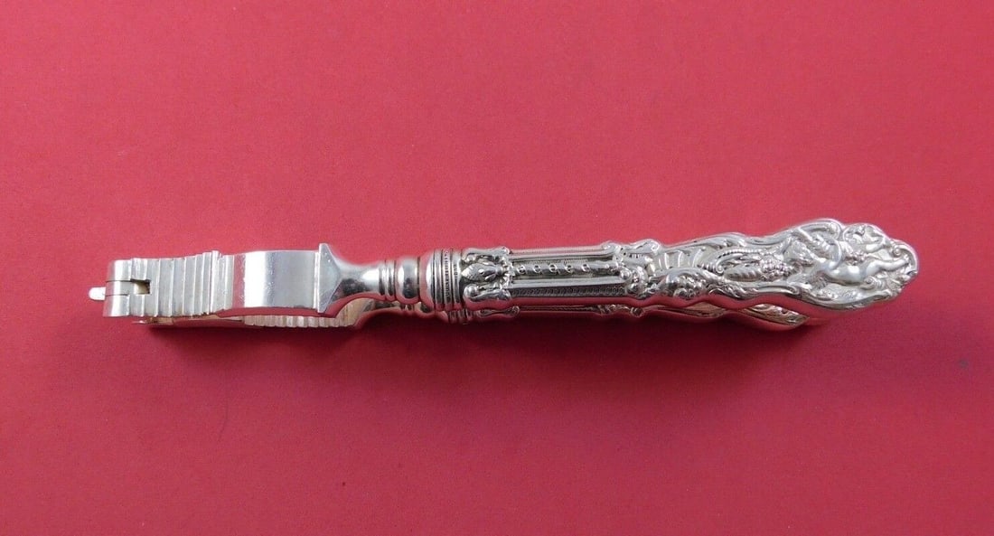 Versailles by Gorham Sterling Silver Nut Cracker Hollow Handle 6 7/8": Versailles by Gorham Sterling Silver Nut Cracker Hollow Handle 6 7/8" Versailles by gorhamversailles by gorham sterling silver hollow handle with stainless nut cracker original, 6 7/8" . It is monogra