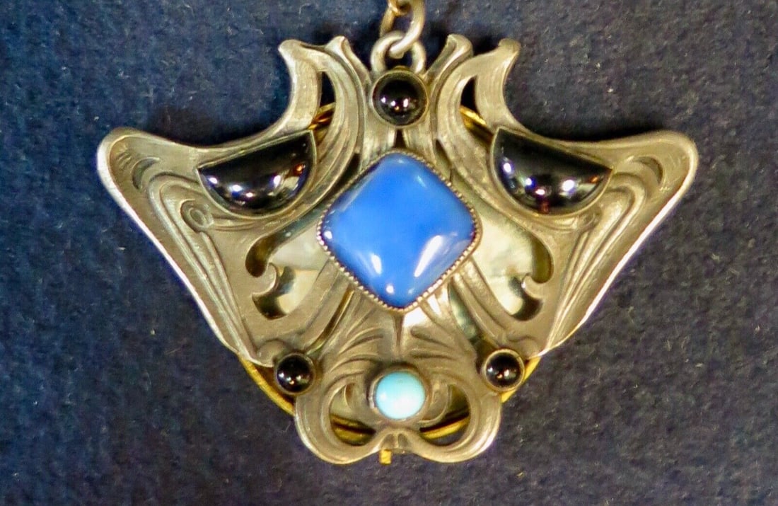 Art Nouveau Period Chatelaine Accessory: Art Nouveau Period Chatelaine Accessory Style: Art Nouveau Depth: 1 3/4" Maker: Unknown Material: Brass Glass Width: 2 3/8" Original/Reproduction: Original Type: Chatelaine Color: Multi-Color Item Hei