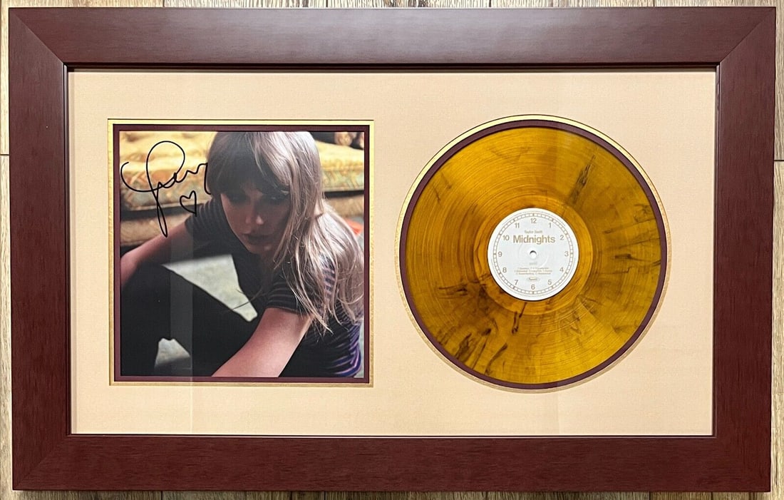 Taylor Swift signed/framed Midnights album insert w/Blood Moon Vinyl display: Taylor Swift signed/framed Midnights album insert w/Blood Moon Vinyl display Industry: Music Signed: Yes Object Type: Record Original/Reproduction: Original None While the lot images are representativ