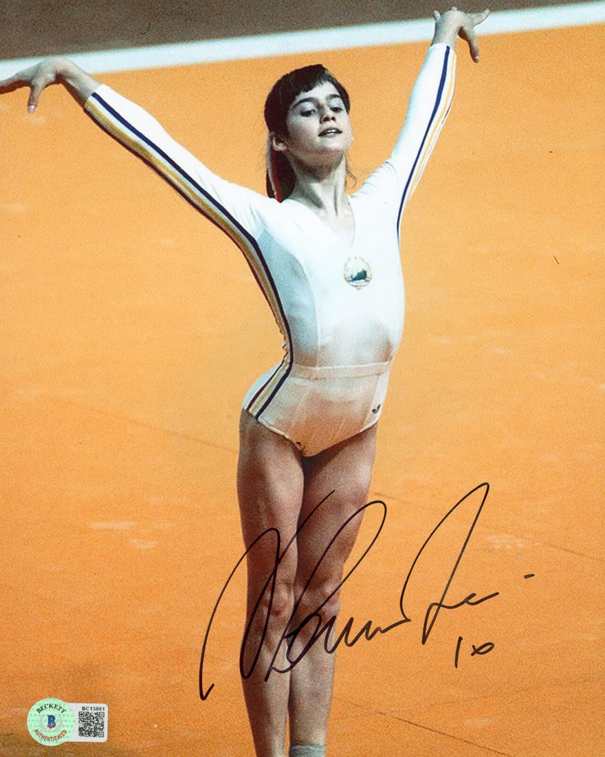 Nadia Comaneci Signed 8x10 Photo Autographed BAS #BC13881: Nadia Comaneci Signed 8x10 Photo Autographed BAS #BC13881 Original/Reprint: Original Product: Photo Player: Nadia Comaneci Autograph Authentication: Beckett Product Coa: Beckett Product Signed By Name