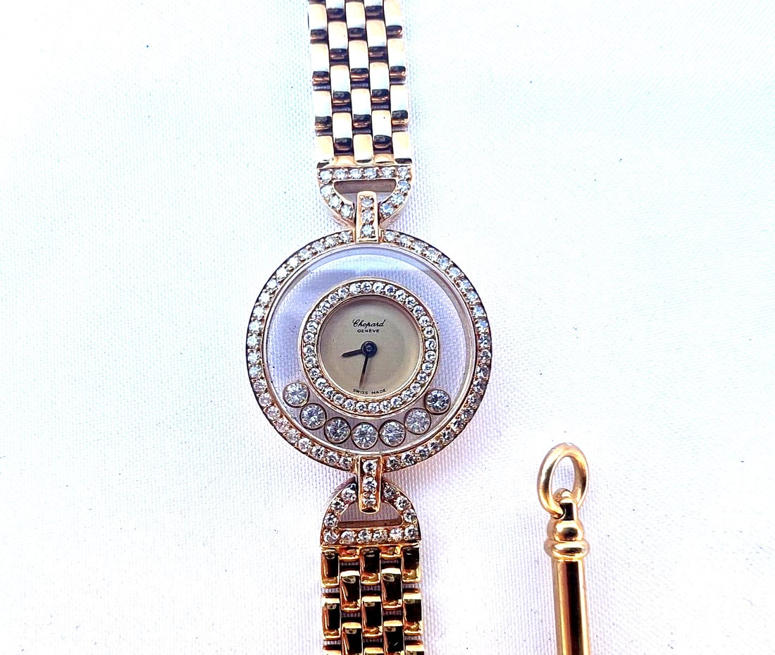 CHOPARD 18K GOLD DIAMOND HAPPY DIAMONDS LADYS WATCH WITH BOX: CHOPARD 18K GOLD DIAMOND HAPPY DIAMONDS LADYS WATCH WITH BOX Type: Wristwatch This is a 1990's Chopard Swiss lady's watch called "Happy diamonds watch" numbered 260094-4097. It measures 6.5" long and