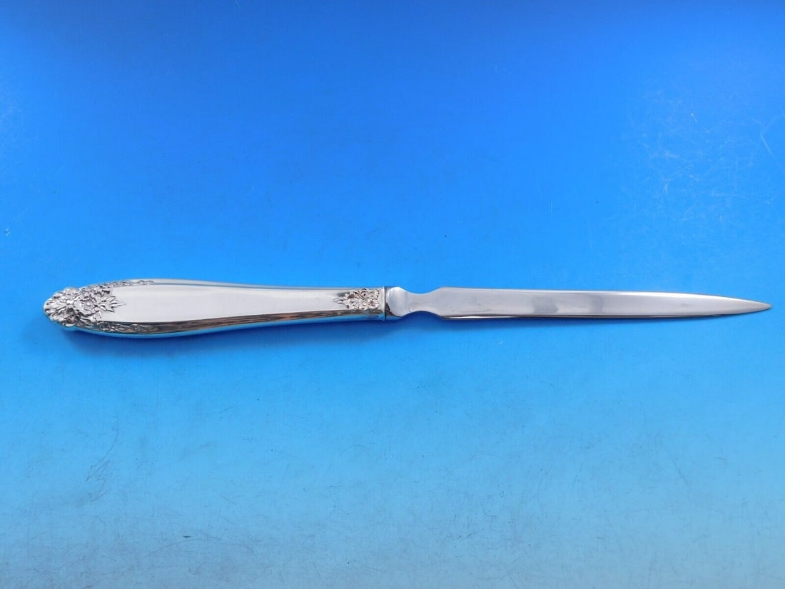Prelude by International Sterling Silver Letter Opener HHWS Custom Made: Prelude by International Sterling Silver Letter Opener HHWS Custom Made Slender and graceful, the smooth clean lines of this refined pattern are distinguished with deeply carved floral ornaments at th