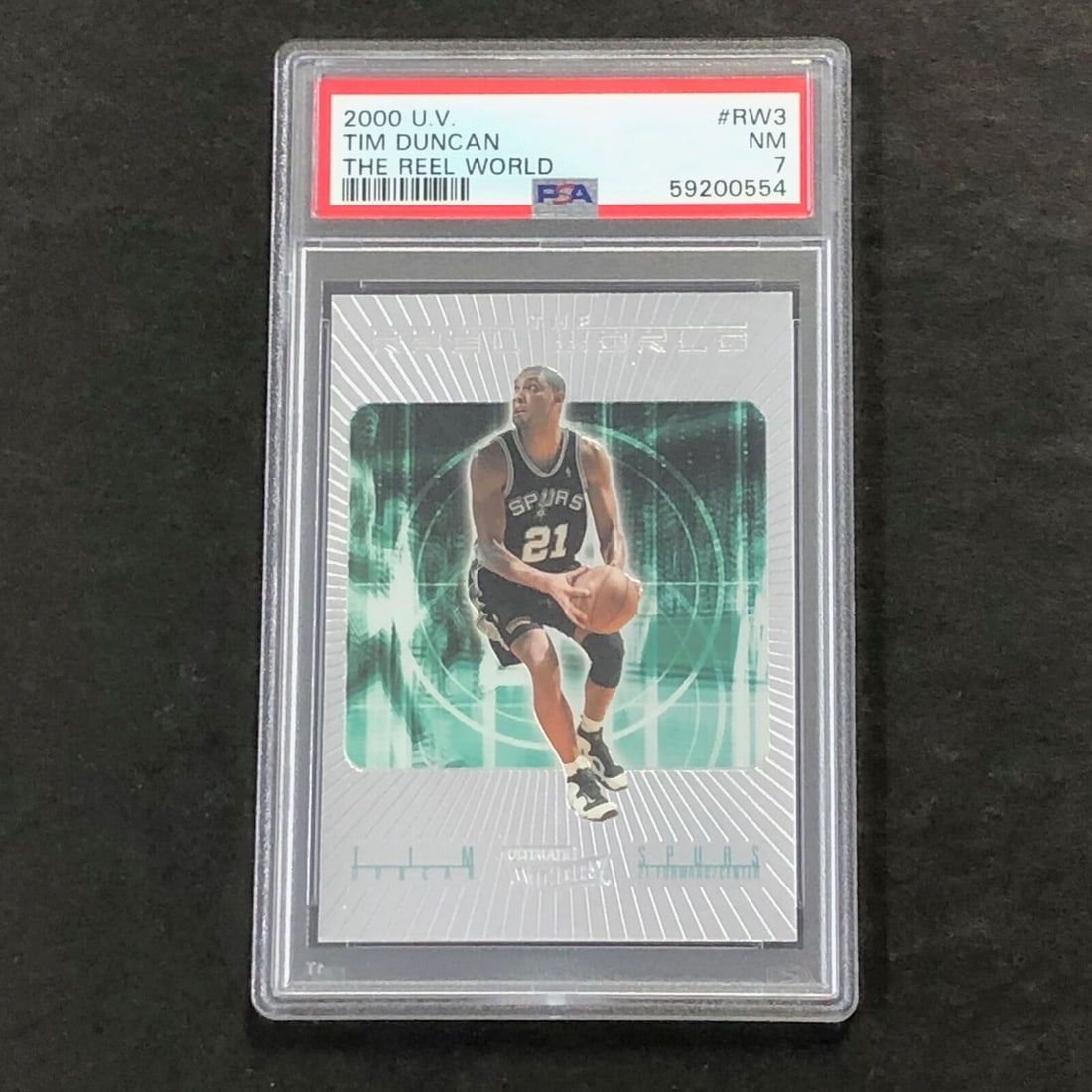 2000 U.V. Tim Duncan #RW3 Tim Duncan PSA 7 NM The Reel World: 2000 U.V. Tim Duncan #RW3 Tim Duncan PSA 7 NM The Reel World Sport: basketball Pre-Owned While the lot images are representative of the item, the size, placement and strength of the signature may vary