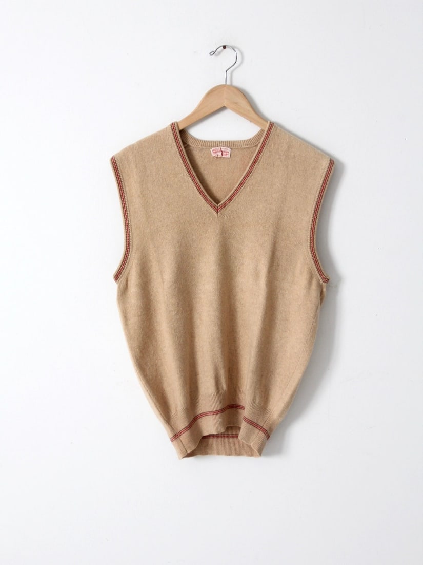Vintage Saks Fifth Avenue Cashmere Vest: Vintage Saks Fifth Avenue Cashmere Vest This is a 1960s Saks Fifth Avenue cashmere sweater vest. Made exclusively for Saks by Caerlee of Scotland the ultra-soft tan vest features red and brown striped