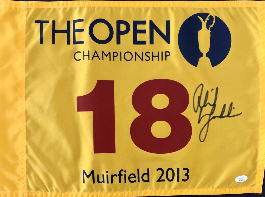 PHIL MICKELSON signed 2013 The Open Championship-Muirfield Pin Flag-JSA AB13279: PHIL MICKELSON signed 2013 The Open Championship-Muirfield Pin Flag-JSA AB13279 Product: Flag Player: Phil Mickelson Sport: Golf-PGA Autograph Authentication: James Spence Authentication (JSA) Origina