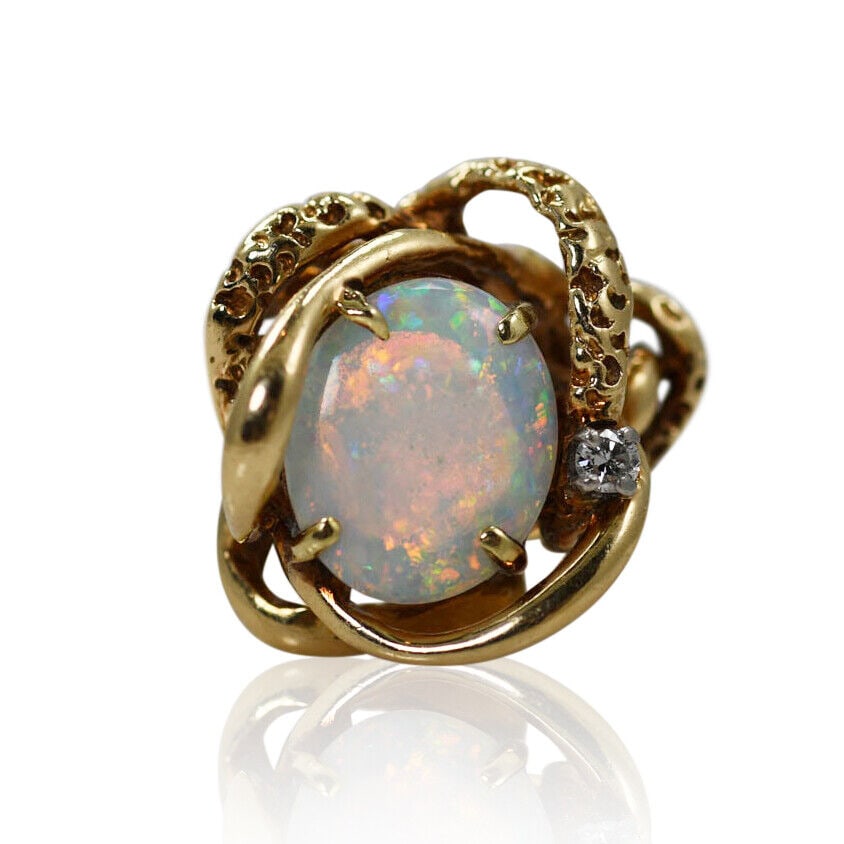 14K Yellow Gold Opal & Diamond Ring 8.2g: 14K Yellow Gold Opal & Diamond Ring 8.2g Type: Ring Secondary Stone: Diamond Sizable: Yes Metal Purity: 14k Metal: Yellow Gold Ring Size: 7 Main Stone: Opal Ladies opal and diamond ring in 14k yellow 