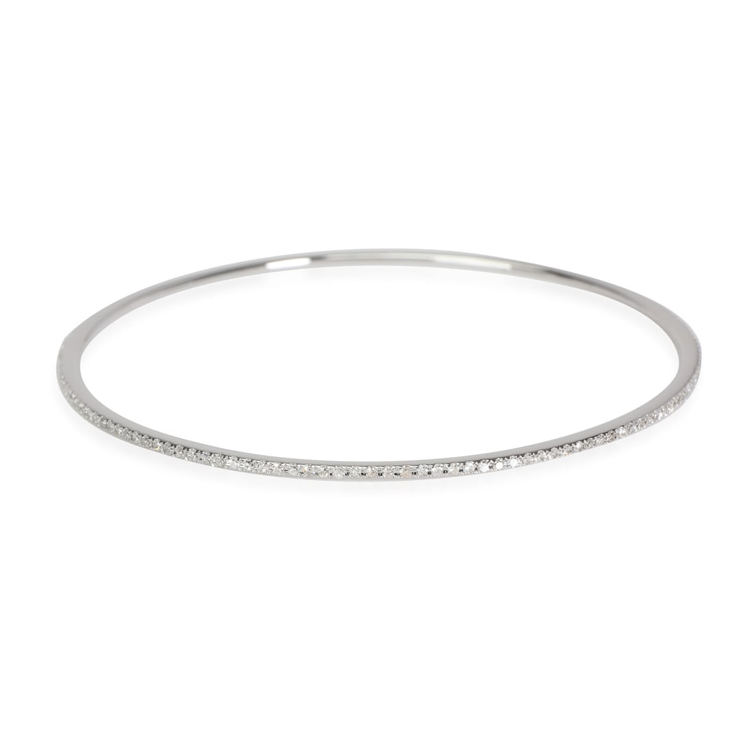 Diamond Thin Micro-Pave Bangle in 18k White Gold 0.75 CTW: Diamond Thin Micro-Pave Bangle in 18k White Gold 0.75 CTW Shape: Round Brilliant Item Length: 8 in Side Stone Type: Diamond Side Stone Weight (Cts): 0.75 Metal Purity: 18k With Original Box/Packaging: