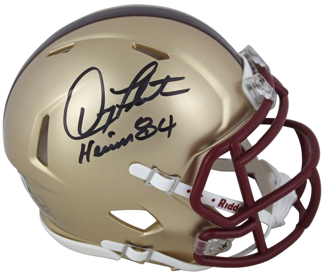 Boston College Doug Flutie "Heisman 1984" Signed Speed Mini Helmet BAS Witness: Boston College Doug Flutie "Heisman 1984" Signed Speed Mini Helmet BAS Witness Sport: Football Product: Helmet Original/Reprint: Original Team: Boston College Eagles Player: Doug Flutie Autograph Auth