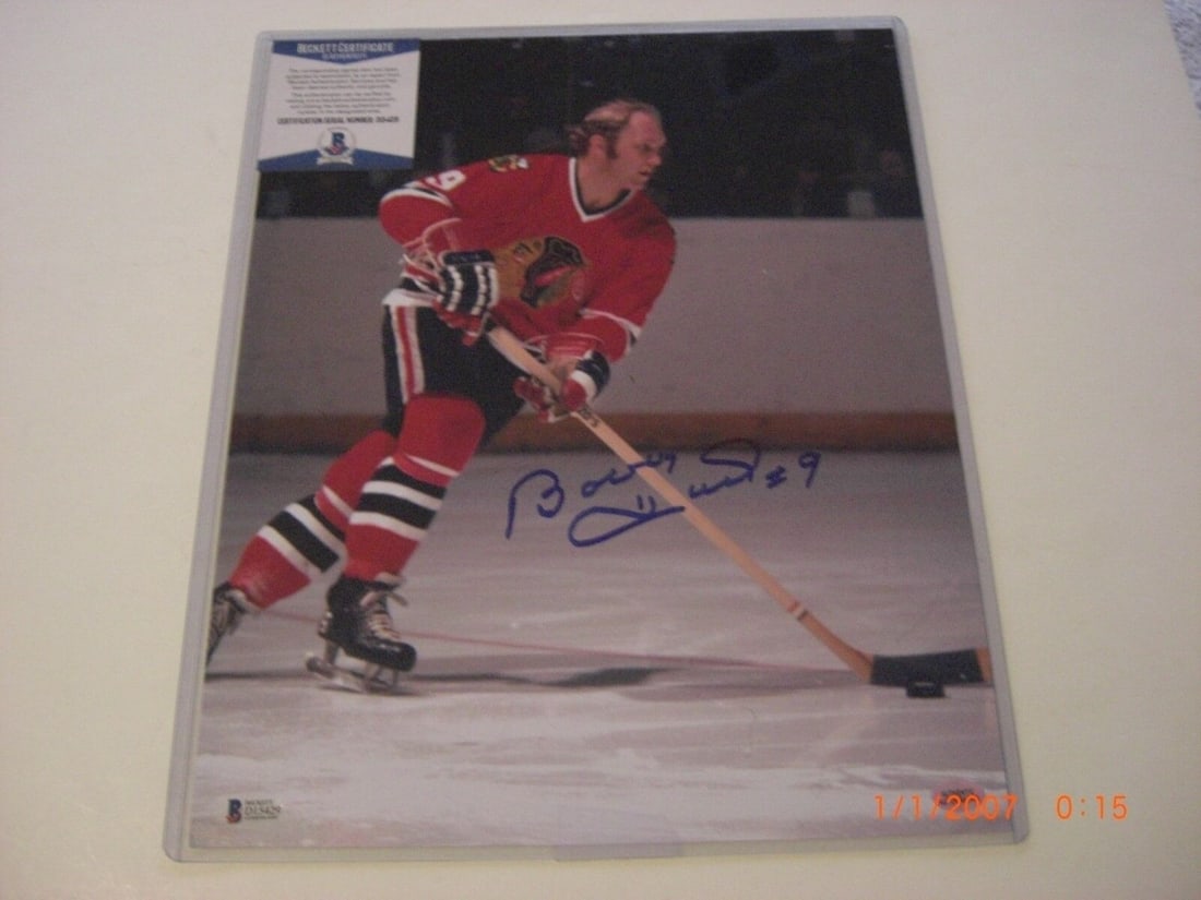 BOBBY HULL CHICAGO BLACKHAWKS HOF BECKETT/COA SIGNED 11X14 PHOTO: BOBBY HULL CHICAGO BLACKHAWKS HOF BECKETT/COA SIGNED 11X14 PHOTO Sport: Hockey-NHL Product: Photo Original/Reprint: Original Pre-Owned While the lot images are representative of the item, the size, pl