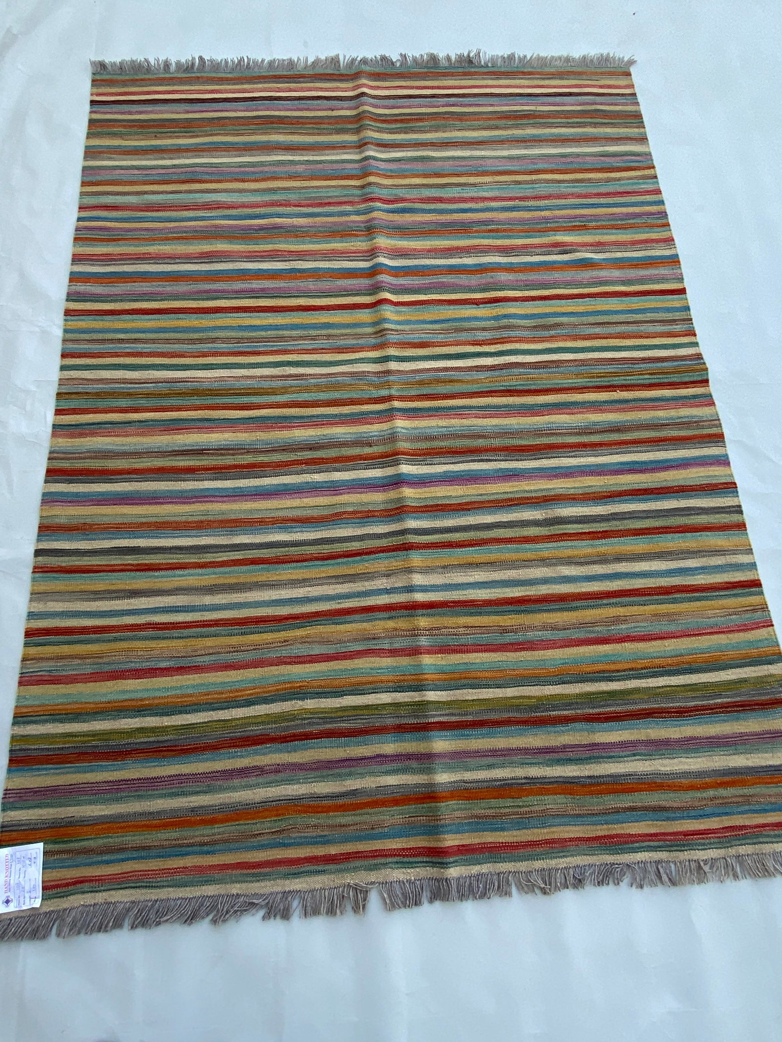 5 x 7 Multi-Color Red Kilim Rug: 5 x 7 Multi-Color Red Kilim Rug Free continental US Shipping Size in Feet: Width: 5 x Length: 7 Size in Inches: Width: 60 in x Length: 84 in Colors: MultiColor Red Ivory Fern Green Weave: 100% Handmad