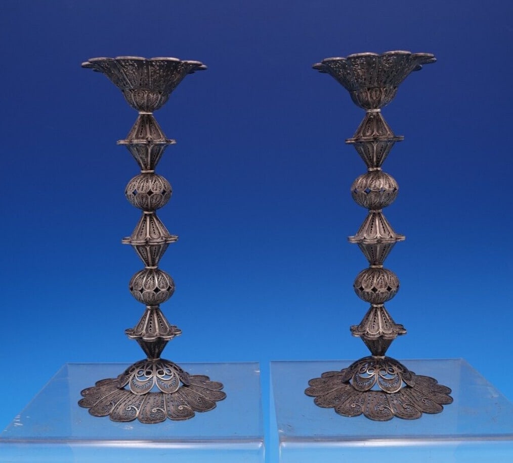 Judaica by Unknown .925 Silver Candlestick Pair Handmade 7" x 3 1/4": Judaica by Unknown .925 Silver Candlestick Pair Handmade 7" x 3 1/4" Judaica by unknownbeautiful judaica. 925 silver handmade filigree candlestick pair (maker unknown). The candlesticks measure 7" (ta