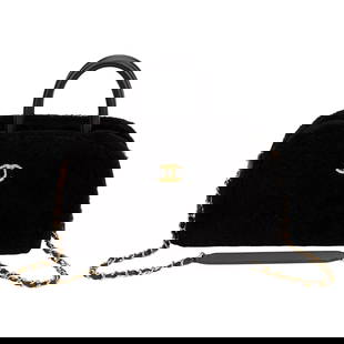 Chanel Black Shearling Bowler Bag Strap: Chanel Black Shearling Bowler Bag Strap Designer: Chanel Dimensions: Height: 7 in (17.78 cm)Width: 5.25 in (13.34 cm)Length: 11.5 in (29.21 cm) Place of Origin: Italy Period: 21st Century Pre-Owned 