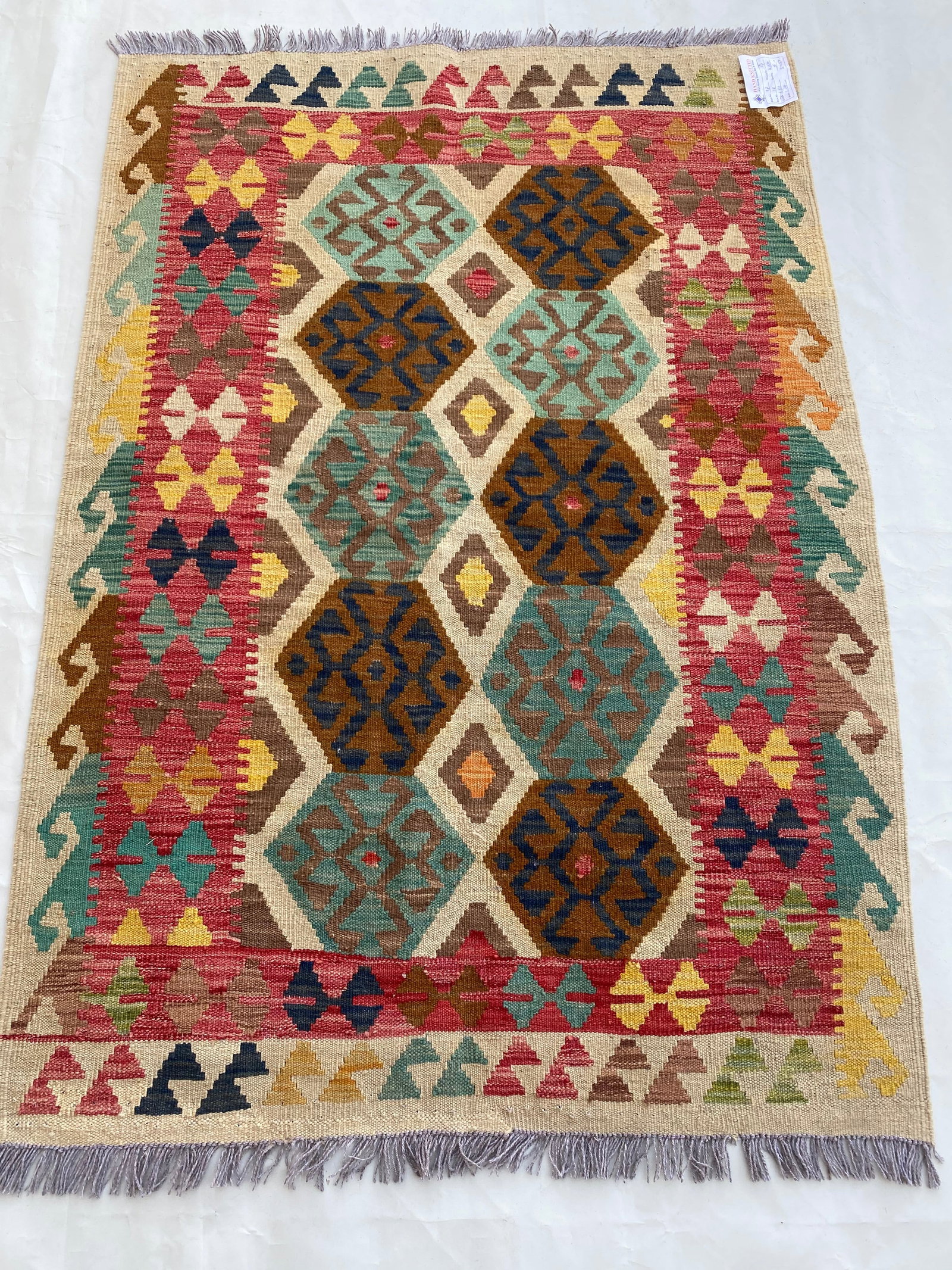 3 x 5 Multi-Color Ivory Handmade Afghanistan Kilim Rug: 3 x 5 Multi-Color Ivory Handmade Afghanistan Kilim Rug Free continental US Shipping Size in Feet: Width: 3 x Length: 5 Size in Inches: Width: 36 in x Length: 60 in Colors: MultiColor Ivory Red Light B