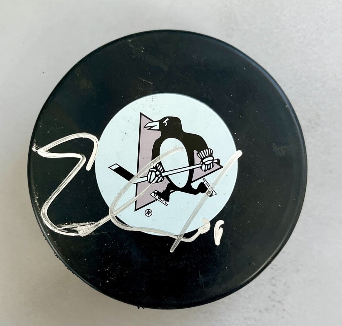 Eric Goddard (Pittsburgh Penguins) signed NHL Logo puck: Eric Goddard (Pittsburgh Penguins) signed NHL Logo puck Sport: Hockey Player: Eric Goddard Signed: Yes Original/Reprint: Original Autograph Authentication: . Product: Puck Team: Pittsburgh Penguins No