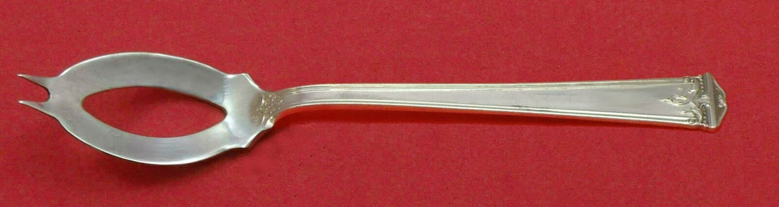 Trianon By International Sterling Silver Olive Spoon 5 3/4 inches Custom Made: Trianon by International Sterling Silver Olive Spoon Ideal 5 3/4" Custom Made Pattern: Trianon Brand: International Type: Serving Spoon Age: Post-1940 Composition: Sterling Silver Maker: International