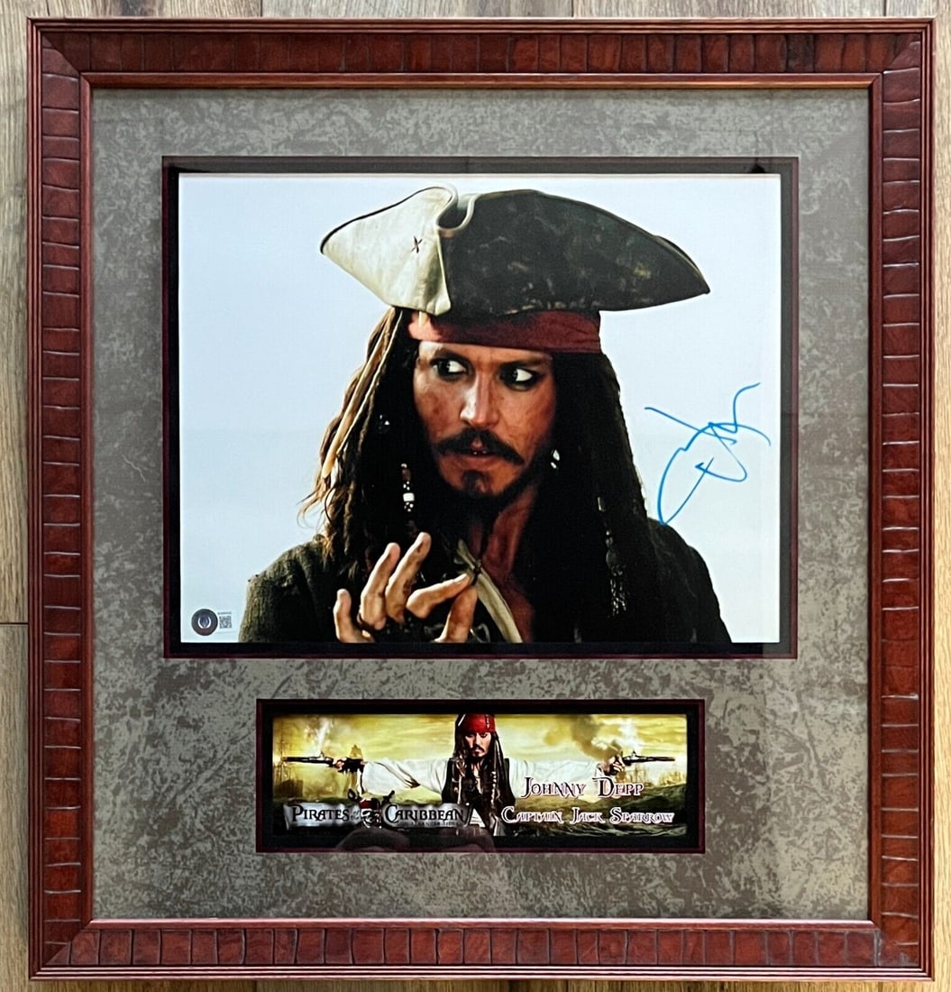JOHNNY DEPP Pirates of the Caribbean Signed 11x14 Framed Display: JOHNNY DEPP (Pirates of the Caribbean) signed 11x14 framed display-BAS BH080430 Industry: Movies Movie: Pirates of the Caribbean Signed By: Johnny Depp Size: 11x14 Signed: Yes Autograph Authentication