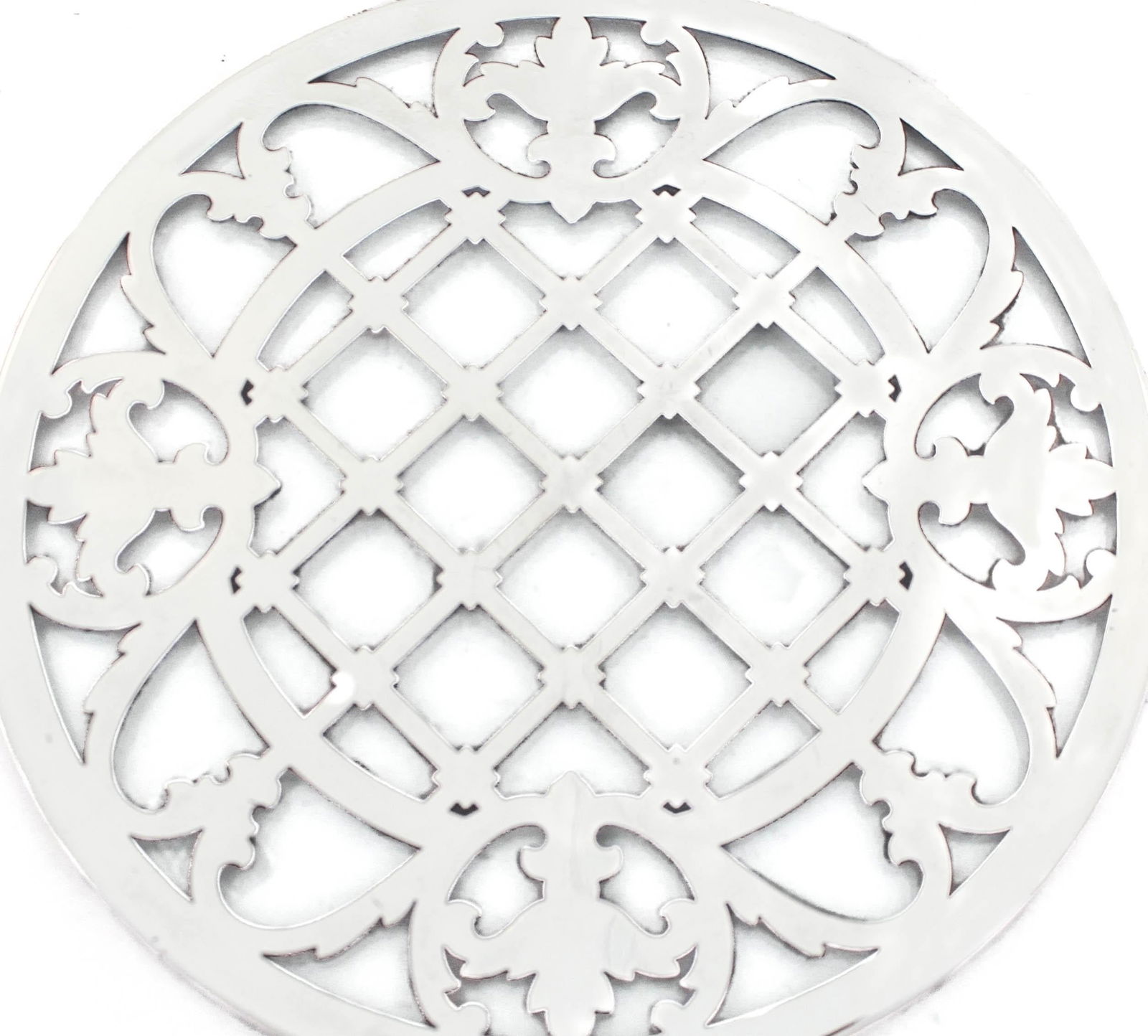 Sterling Silver Trivet by Webster Company: This exquisite sterling silver trivet, crafted by the renowned Webster Company, hails from the 1930s, showcasing a timeless design. Made in the United States, it features remarkable craftsmanship and