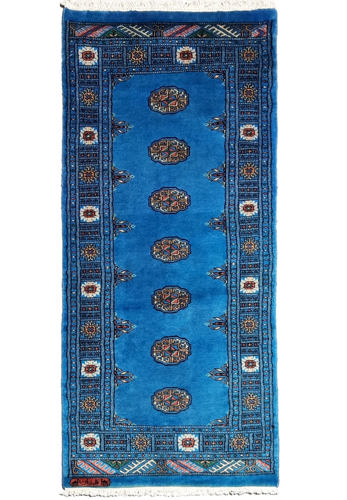 2 x 6 Handmade Bokhara Runner Rug Blue Wool: This exquisite handmade Bokhara runner rug is a perfect fit for your entryway or hallway. Crafted in Pakistan, this rug features a beautiful blue color, hand-knotted from soft wool. With a life expect