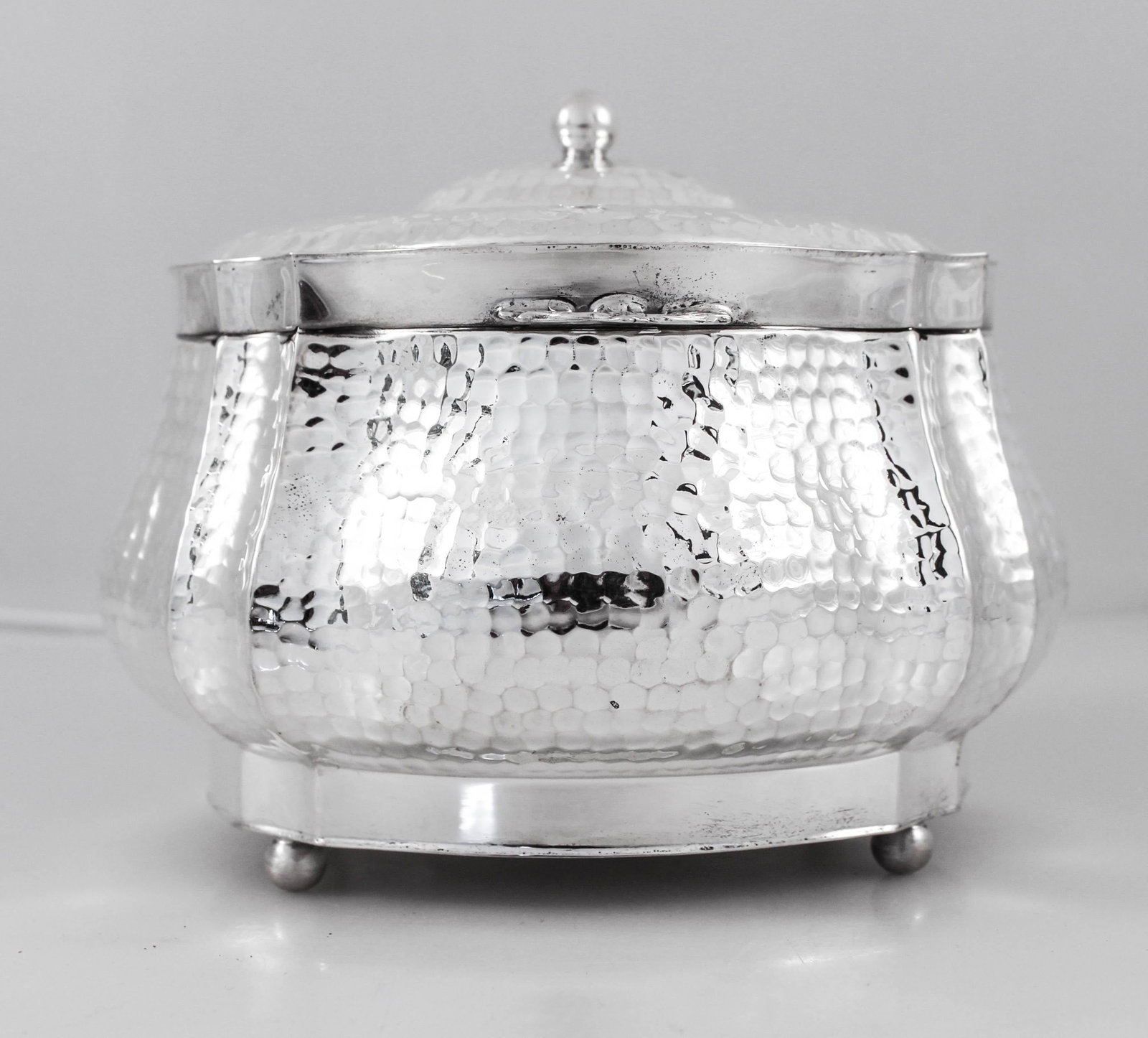 Vintage Sterling Silver Etrog Box from Israel: This vintage Etrog box, crafted in Israel circa 1970, features a unique hammered design in sterling silver. Perfect for collectors or as a decorative piece, this box exemplifies the craftsmanship of t