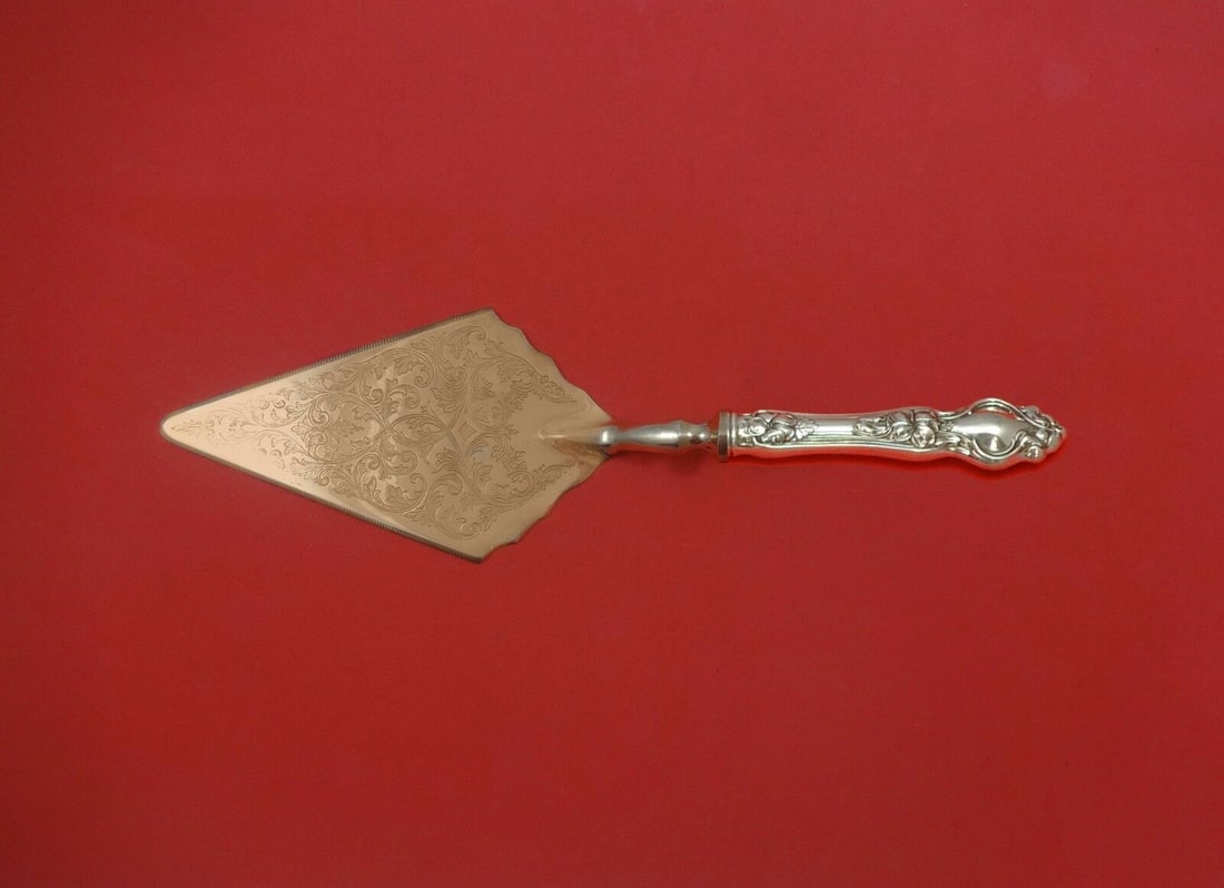 Violet Sterling Silver Pastry Server with Vermeil Blade by Wallace: Violet by Wallace Sterling Silver Pastry Server Fancy Vermeil HH Custom Pattern: Violet Brand: Wallace Type: Serving Pieces Age: Post-1940 Composition: Sterling Silver Maker: Wallace Violet by wallace