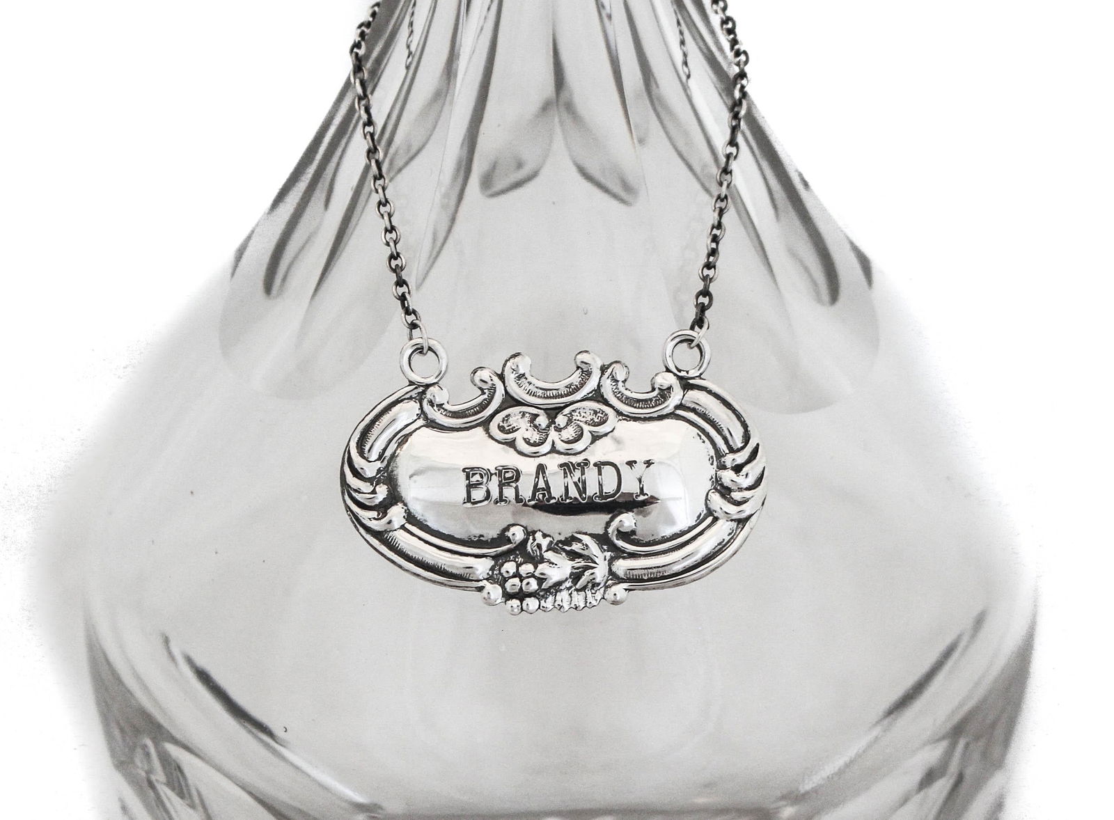 Sterling Silver Brandy Liquor Label by Wallace Silversmiths: Sterling Silver Brandy Liquor Label by Wallace Silversmiths This exquisite sterling silver brandy liquor label, crafted by Wallace Silversmiths, features a classic design. It measures 1 inch in height