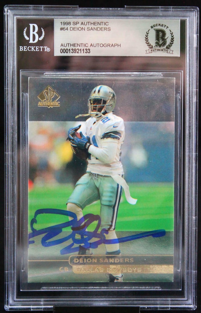 1998 Upper Deck SP Authentic Deion Sanders Autographed Trading Card #64 Dallas Cowboys BAS 10: 1998 Upper Deck SP Authentic Deion Sanders Autographed Trading Card #64 Dallas Cowboys BAS 10 This is a 1998 Upper Deck SP Authentic trading card featuring Deion Sanders of the Dallas Cowboys. Hand-si