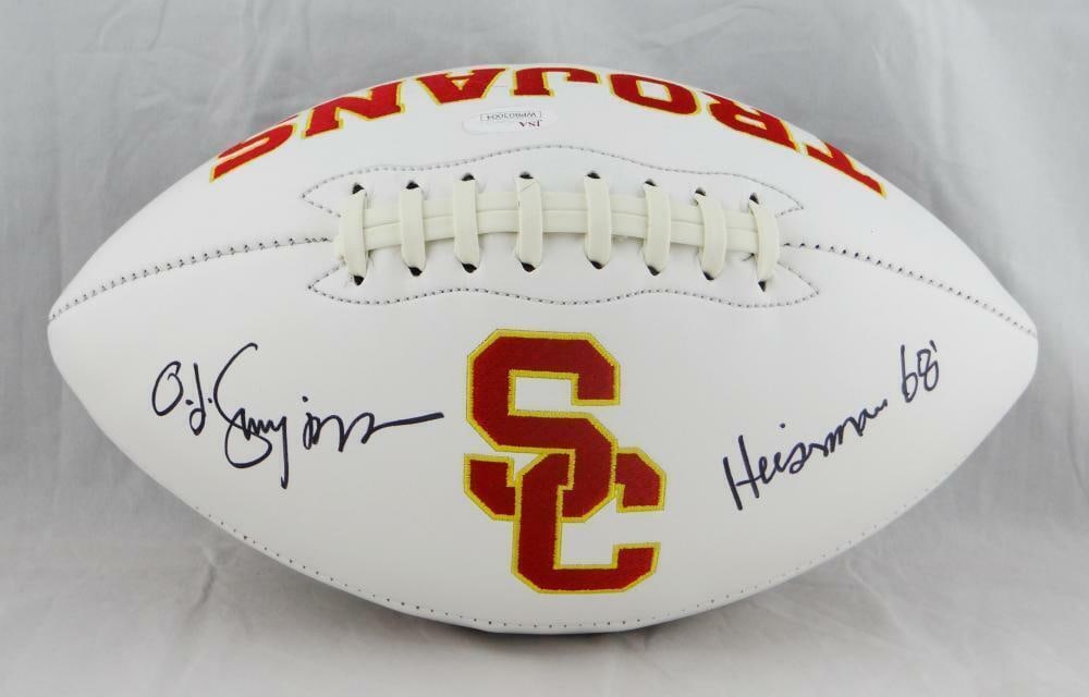 O. J. Simpson Autographed USC Trojans Football with Heisman Certification: O. J. Simpson Autographed USC Trojans Football with Heisman Certification This original USC Trojans logo football is autographed by O. J. Simpson, featuring Heisman recognition. Authenticated by James