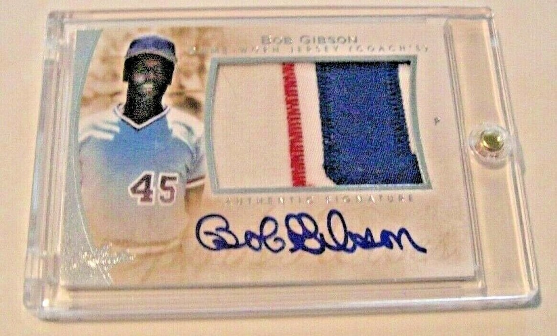 BOB GIBSON 2015 LEAF Q GAME USED JERSEY AUTOGRAPHED BASEBALL CARD: BOB GIBSON 2015 LEAF Q GAME USED JERSEY AUTOGRAPHED BASEBALL CARD This Bob Gibson 2015 Leaf Q card features a game-used jersey and is autographed. Ideal for baseball collectors and fans of the Hall of