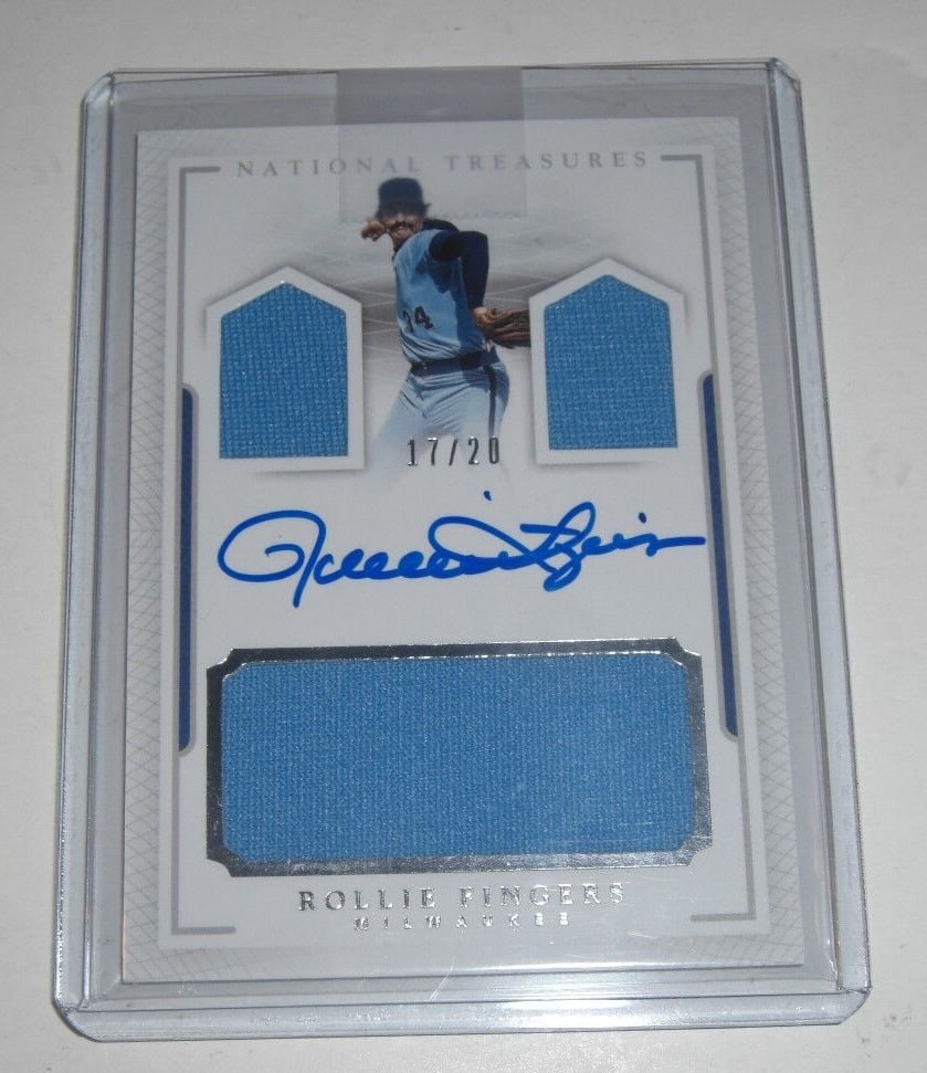 Rollie Fingers National Treasures Game Used Triple Jersey Auto 17 of 20 Signed Card: Rollie Fingers National Treasures Game Used Triple Jersey Auto 17 of 20 Signed Card This Rollie Fingers National Treasures card features a game-used triple jersey and is autographed. Limited to 17 of 