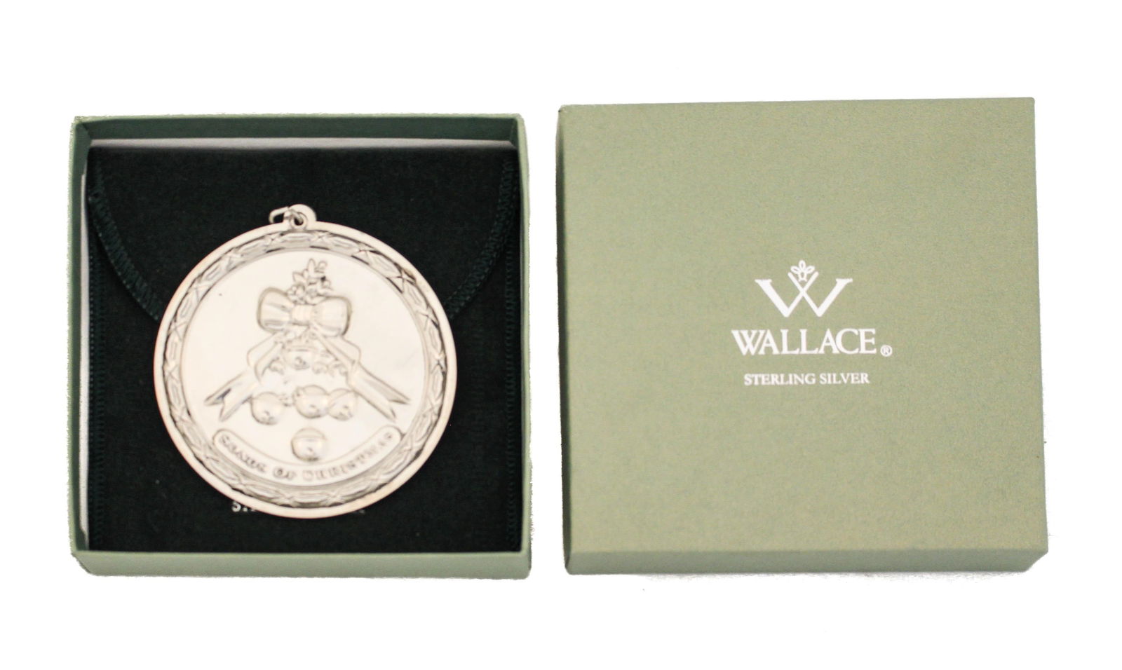 Sterling Silver Christmas Ornament by Wallace Silversmiths: Sterling Silver Christmas Ornament by Wallace Silversmiths This exquisite Sterling Silver Christmas Ornament by Wallace Silversmiths showcases a stunning design, perfect for holiday decor. Crafted fro